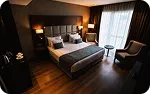 A double room, an armchair by the window